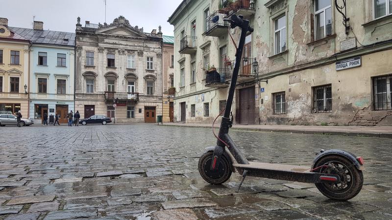 E-scooter parked on the cobblestones of Rynok Square in Lviv
